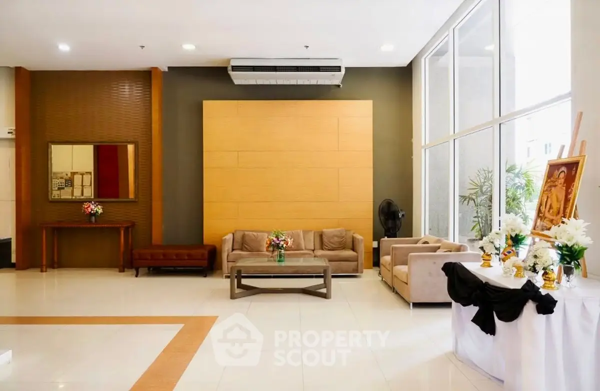 Spacious and elegant lobby with modern seating and large windows