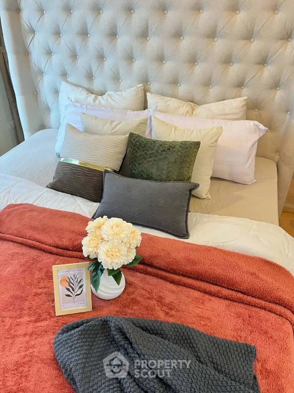 Luxurious bedroom with plush pillows and elegant decor, perfect for relaxation.