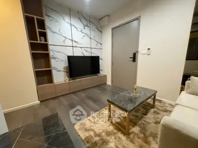 Modern living room with stylish marble accents and sleek furniture
