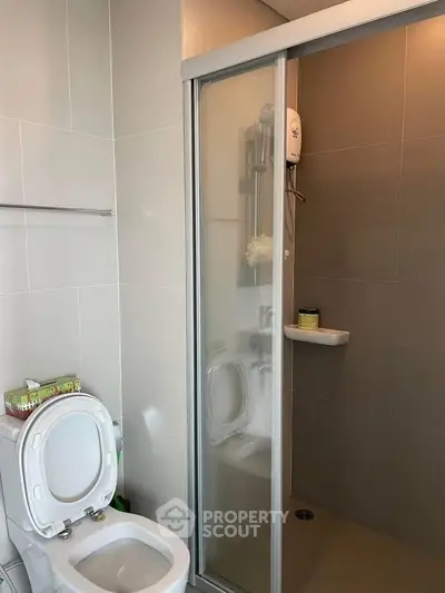 Modern bathroom with shower and toilet in sleek design