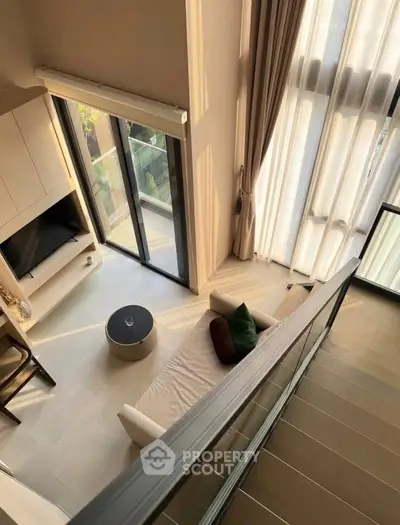 Stunning modern living room with high ceilings and large windows offering abundant natural light.