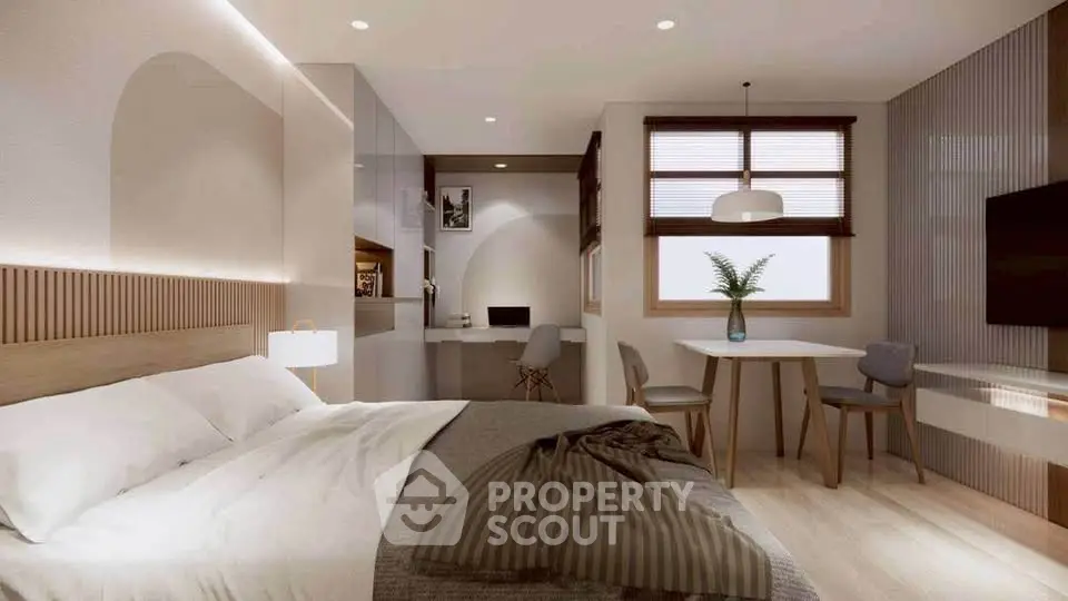 Modern bedroom with stylish decor, featuring a cozy bed, study area, and dining space, perfect for urban living.
