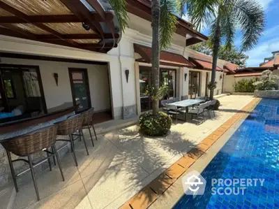 Luxurious villa with private pool and spacious patio in tropical setting