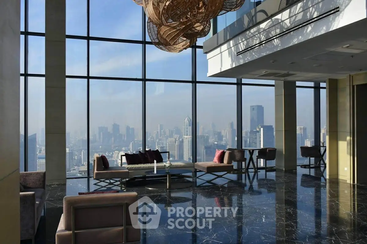 Luxurious high-rise living room with panoramic city views and modern decor.