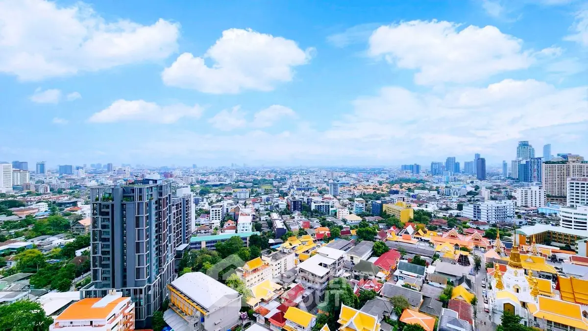 Stunning cityscape view from high-rise building showcasing vibrant urban skyline.