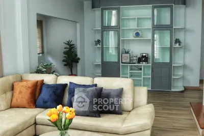 Spacious living room with modern decor and cozy seating area