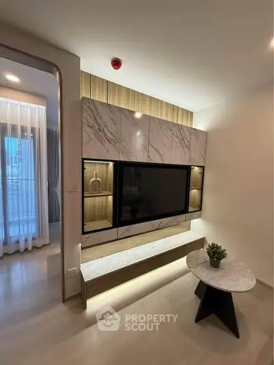 Modern living room with elegant TV unit and marble accents