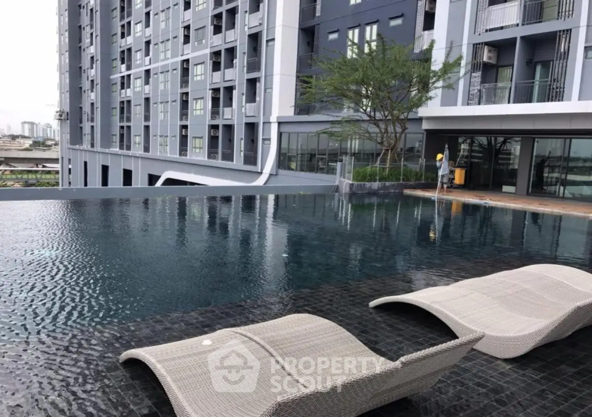 Luxurious apartment building with stunning rooftop infinity pool and modern design.