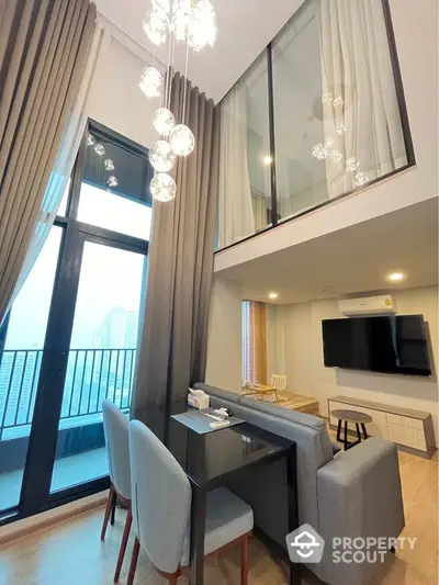 Modern duplex living room with high ceiling and balcony view in luxury apartment