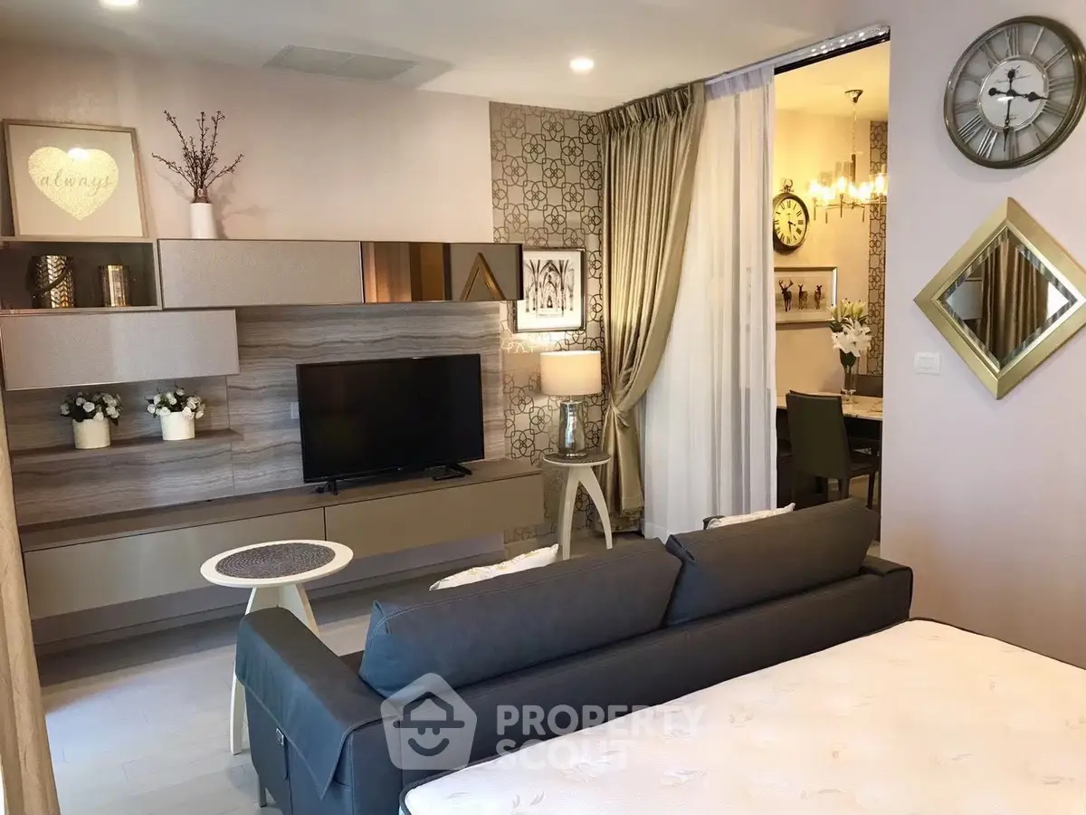 Modern living room with stylish decor and open layout to dining area