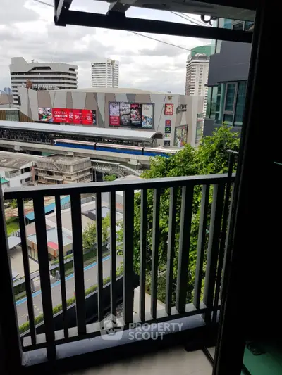 Urban balcony with city view overlooking modern buildings and skyline