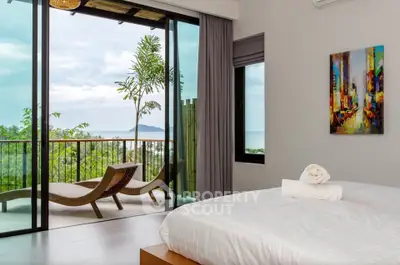 Luxurious bedroom with stunning ocean view and spacious balcony, perfect for relaxation and tranquility.