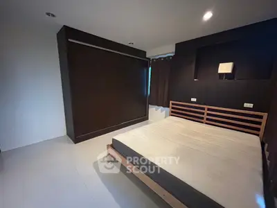 Spacious bedroom with modern design and ample natural light