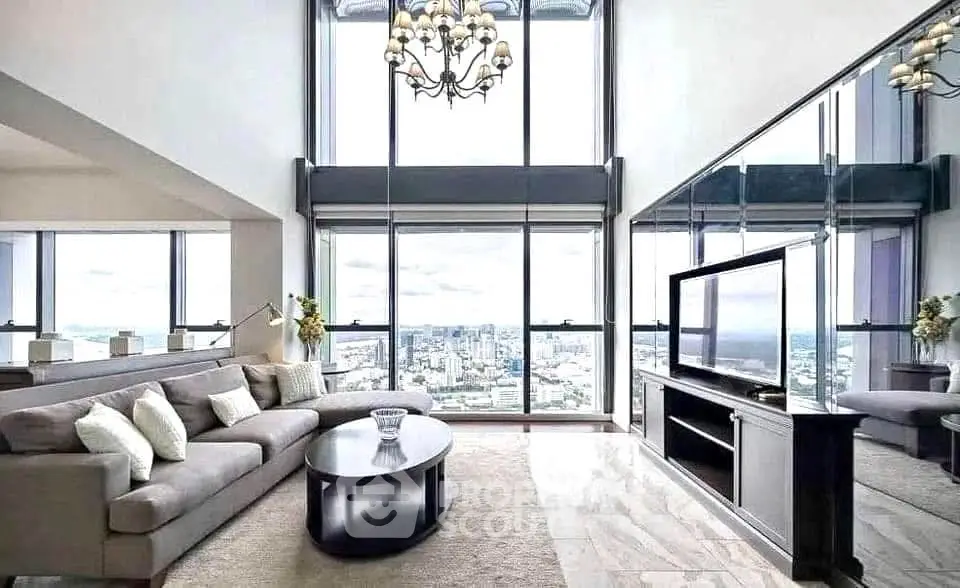 Luxurious high-rise living room with panoramic city views and elegant decor.
