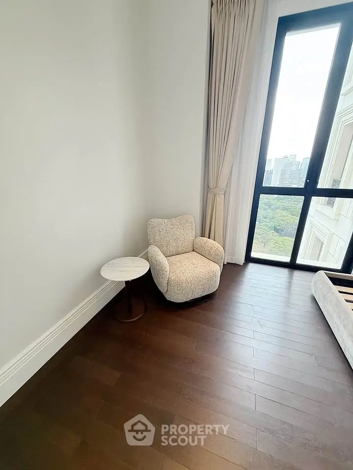 Elegant corner with armchair and window view in modern apartment