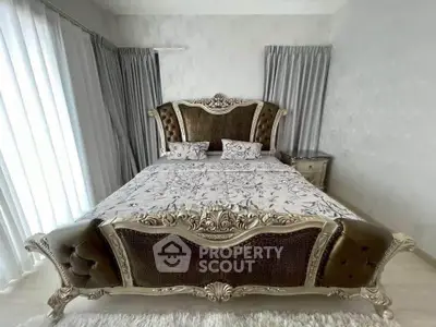 Luxurious bedroom with ornate bed and elegant curtains