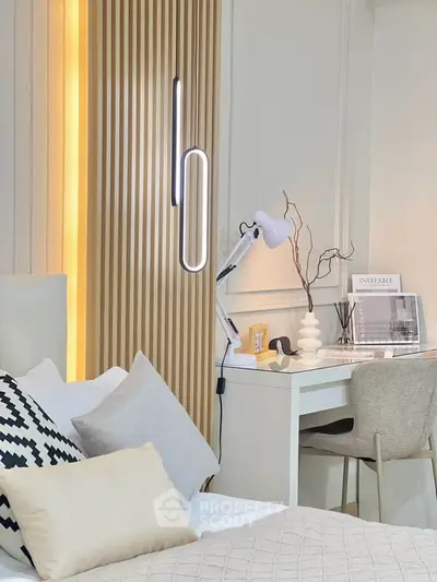 Modern bedroom with stylish decor and cozy workspace