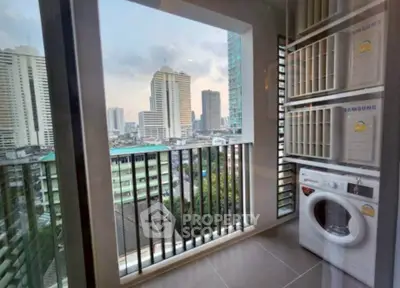 Modern balcony with city view and stacked washing machines in a high-rise apartment.