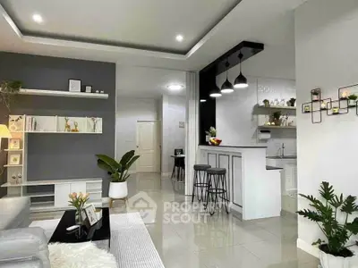 Modern open-plan living room with stylish kitchen and elegant decor