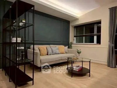 Modern living room with stylish sofa and shelving unit, perfect for cozy evenings.