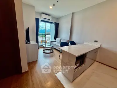 Modern living room with open kitchen and balcony view in stylish apartment