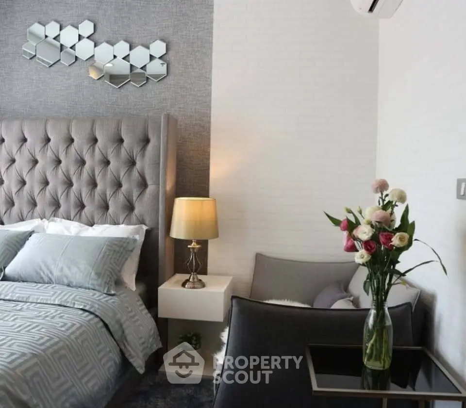 Elegant bedroom with tufted headboard and modern decor