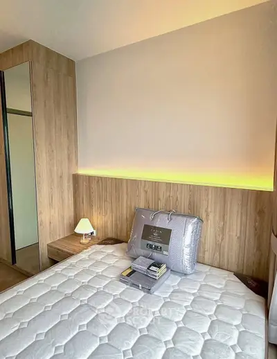Modern bedroom with stylish wood paneling and cozy lighting