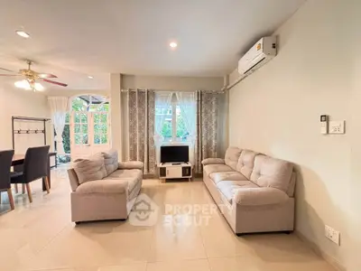 Spacious living room with modern furniture and natural light