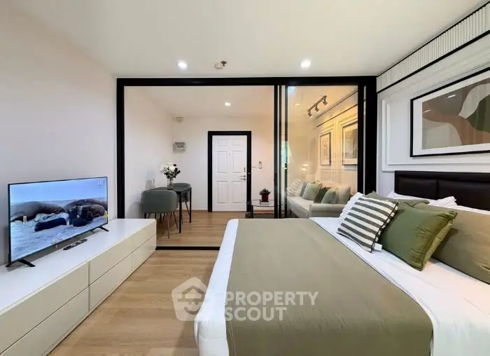 Modern bedroom with glass partition and stylish decor