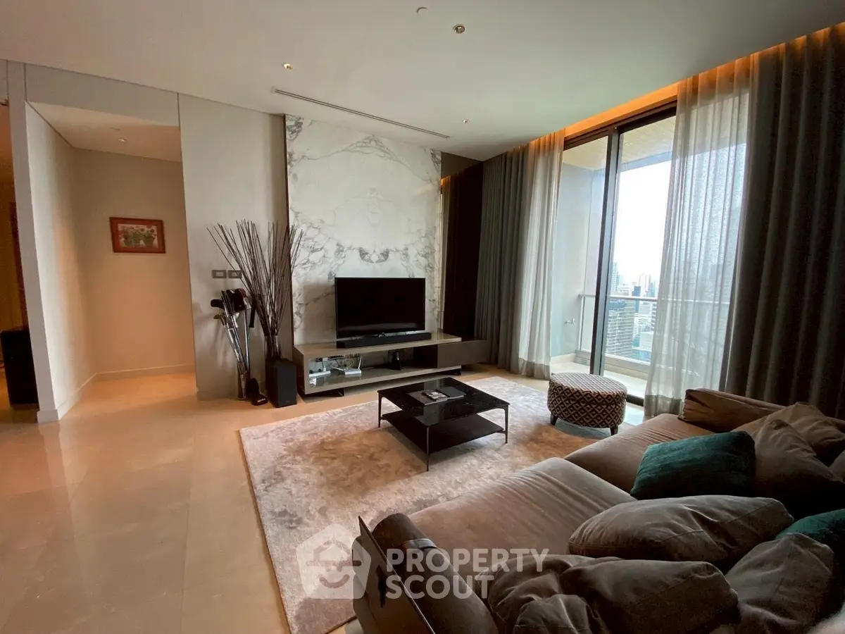 Luxurious living room with modern decor and balcony view