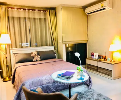 Cozy bedroom with modern decor and ambient lighting, featuring a comfortable bed and stylish furnishings.