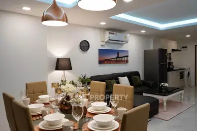 Modern open-plan living room and dining area with stylish decor and contemporary furniture.