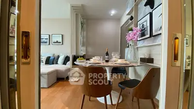 Elegant dining area with modern decor and cozy living room view