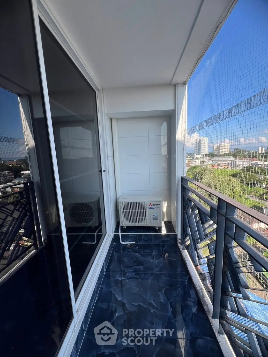 Modern balcony with city view and air conditioning unit