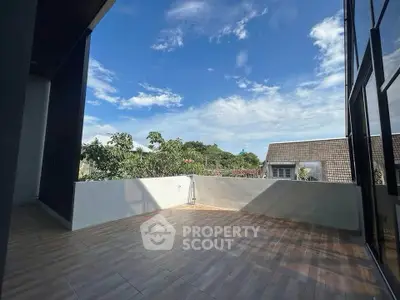 Spacious balcony with stunning sky view, perfect for relaxation and outdoor activities.