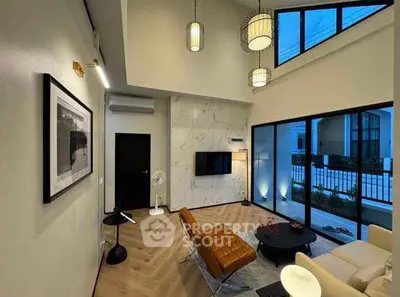 Modern living room with high ceiling and stylish decor