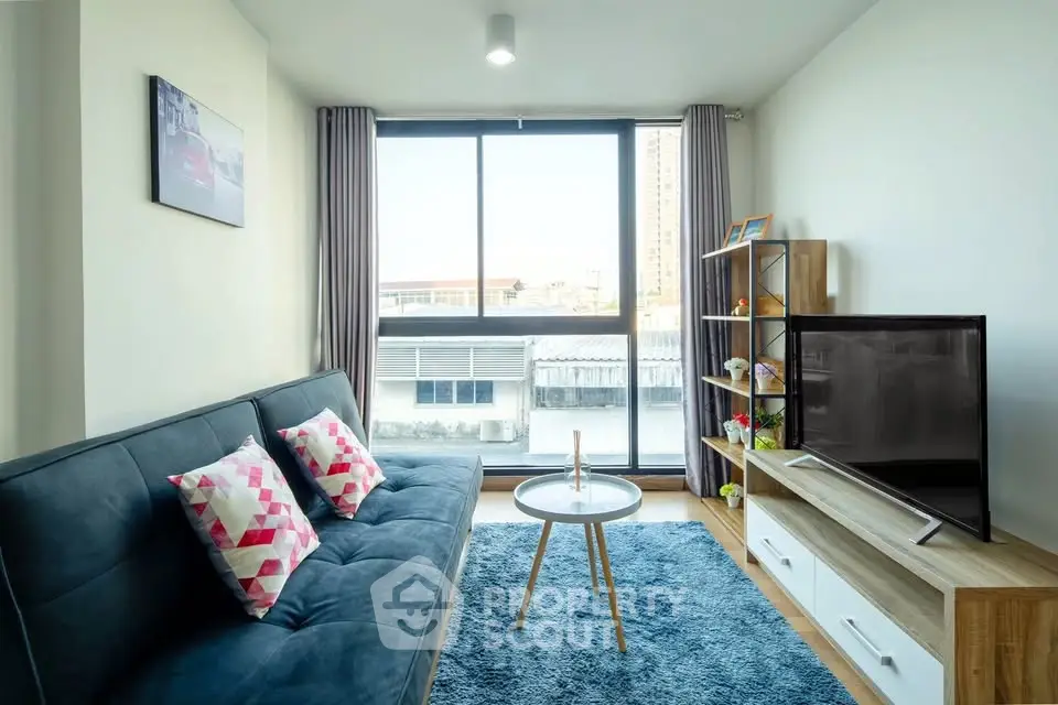 Bright and modern living room with large window and stylish decor