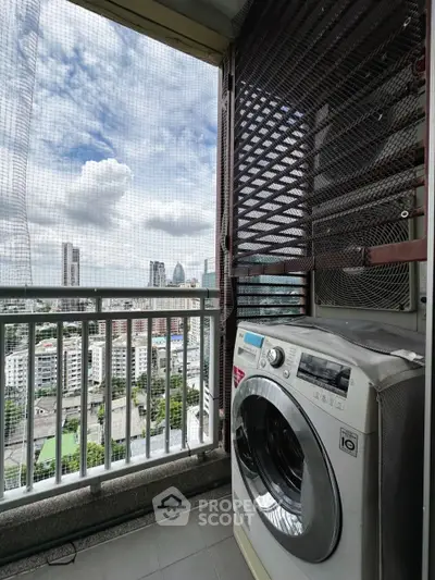 High-rise balcony with washing machine and stunning city view