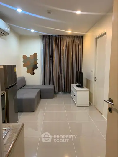 Modern living room with sleek furniture and stylish decor in a cozy apartment.
