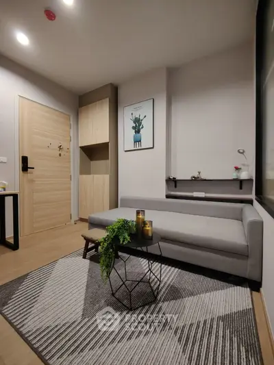 Modern living room with stylish decor and cozy seating area, perfect for relaxation and entertaining.