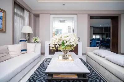 Luxurious living room with elegant decor and plush seating in a modern home.