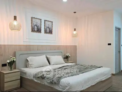 Modern bedroom with stylish decor and cozy lighting, perfect for relaxation and comfort.