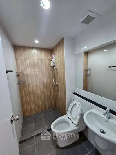 Modern bathroom with shower and toilet in sleek design