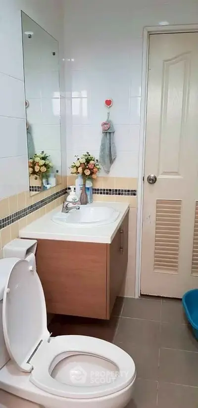 Charming bathroom with modern fixtures and elegant decor, perfect for a cozy home.