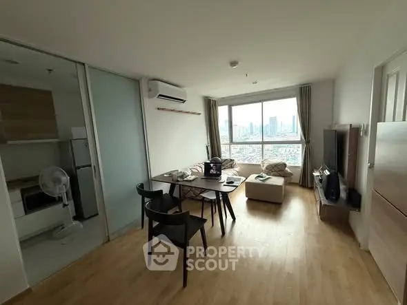 Modern living room with city view, open layout, and stylish furniture