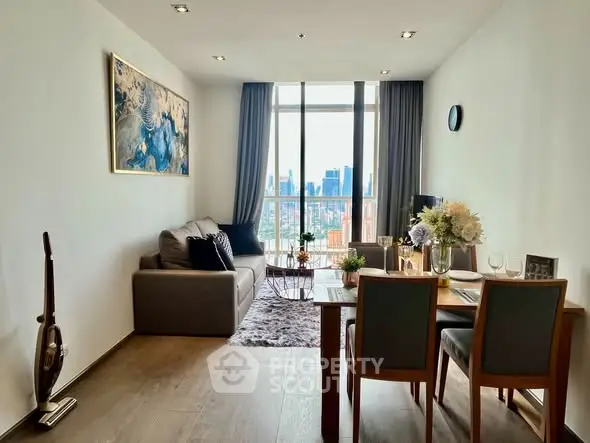 Modern living room with city view, stylish decor, and dining area in a high-rise apartment.