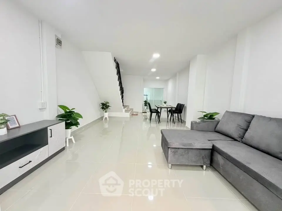 Spacious modern living room with sleek furniture and elegant decor