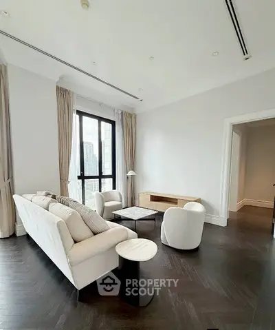 Luxurious modern living room with elegant furniture and city view, perfect for urban living.