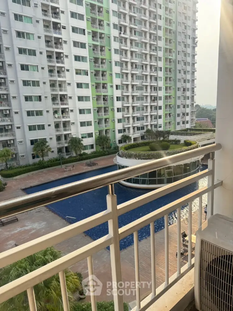 High-rise apartment view with pool and modern balcony