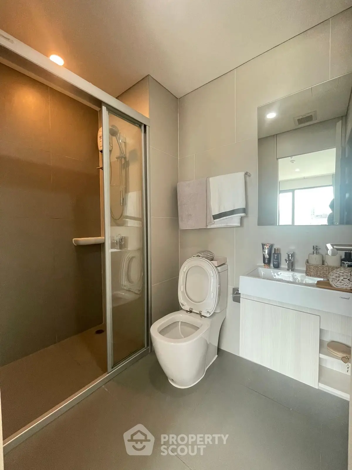 Modern bathroom with sleek shower and contemporary fixtures.